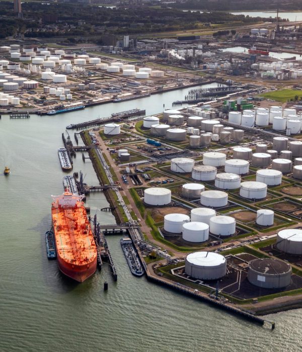 Aerial,View,Of,A,Large,Orange,Oil,Tanker,Moored,At